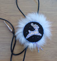 White deer bolo tie backed with fur and leather 