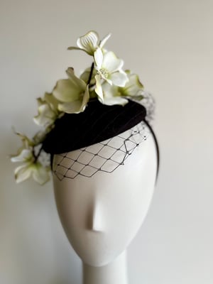 Image of Black felt button trimmed with flowers