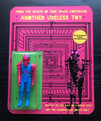 Another useless toy (black figure with pink eyes) 