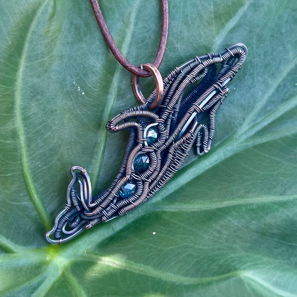 Image of Oceanborne Grace – Moss Kyanite Dolphin Pendant