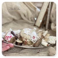 Image 2 of Handmade pin cushion sitting on a silver tray full of French sewing notions