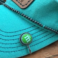 Green M&M Cap Candy
