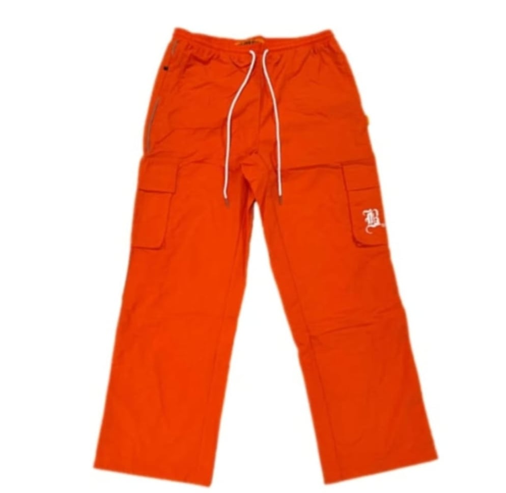 Image of ORANGE NYLON CARGO PANTS (REFLECTIVE PIPING)