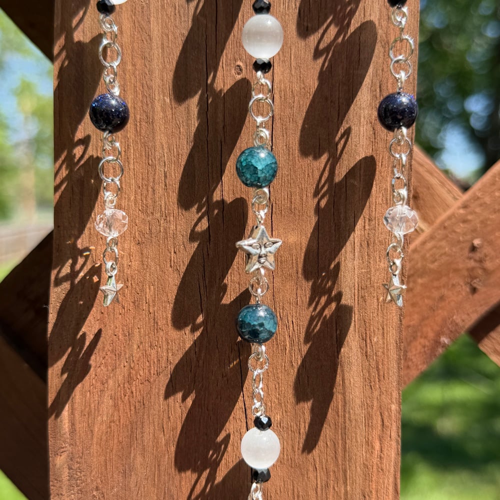 Image of face in the moon sun catcher 