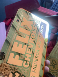 Image 1 of GOLD & PINK FELIX CHEVROLET ICONIC LICENSE PLATE