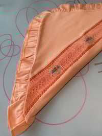 Image 1 of girls peach smocked blanket 
