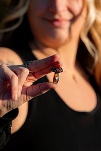 Image 1 of “psychedelic red rodeo” opal mushroom pendant