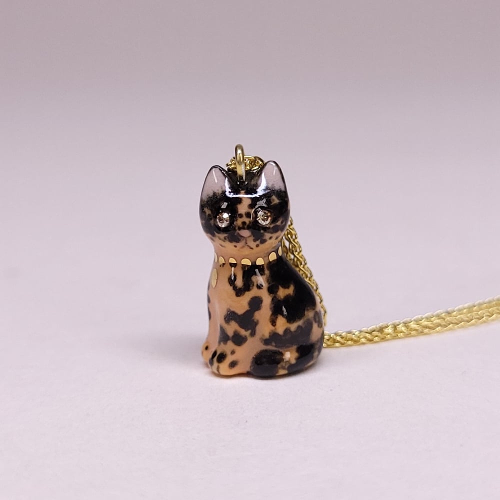 Image of Tortoiseshell Porcelain & Gold Vermeil Sitting Kitten Pendant