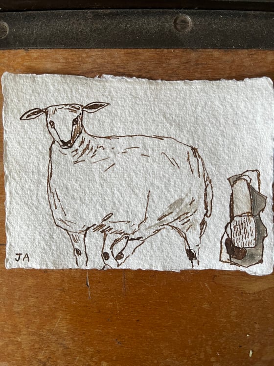 Image of Sheep and standing stone 