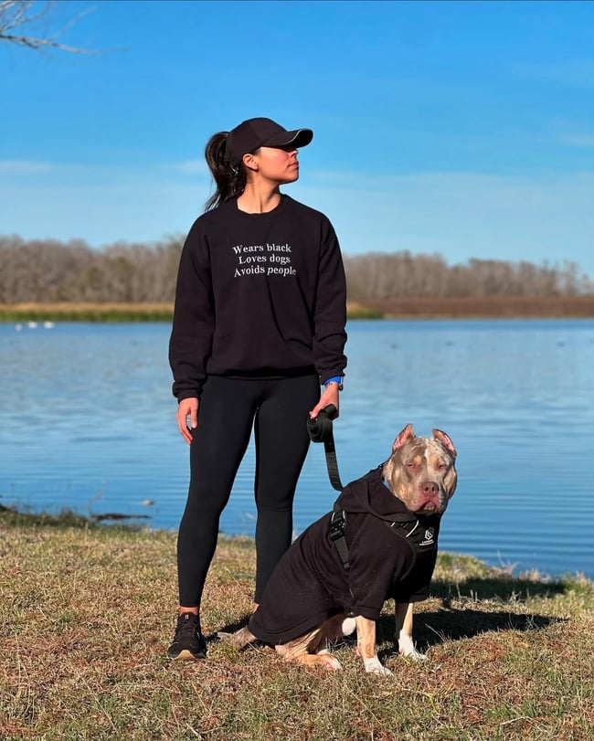 WEARS BLACK LOVES DOGS AVOIDS PEOPLE