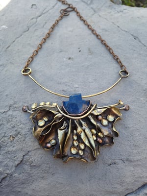 Blue stone and bullet cussings necklace 