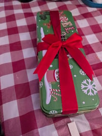 Image 2 of 15 count buckeyes in a Christmas tin