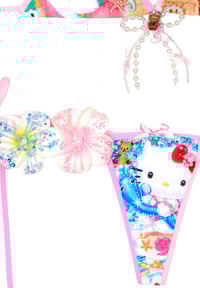 Image 8 of tanned hellokitty in the beach ball game