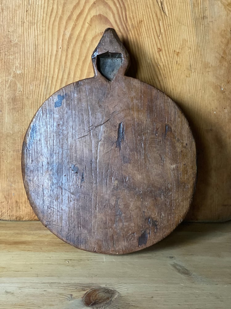 Image of Large wooden chapati board with carved detail