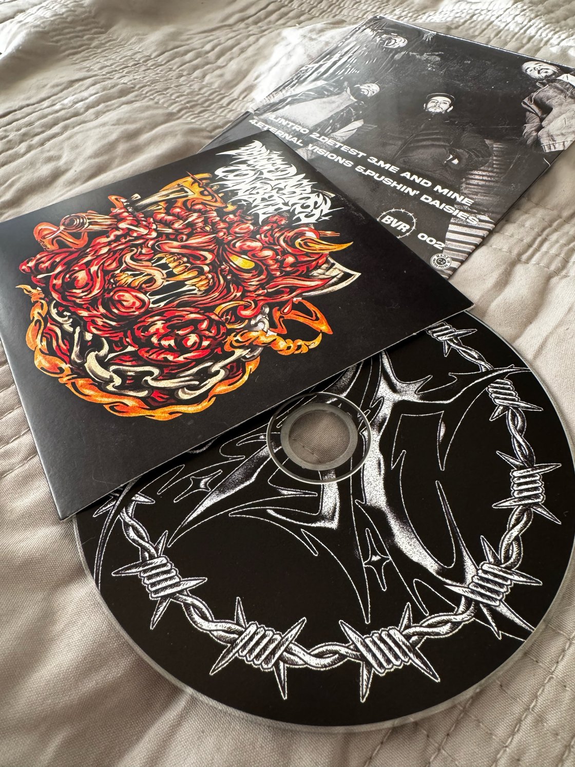 Image of CD Dragged Across Concrete S/T 