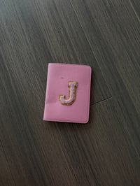 “J” passport book cover 