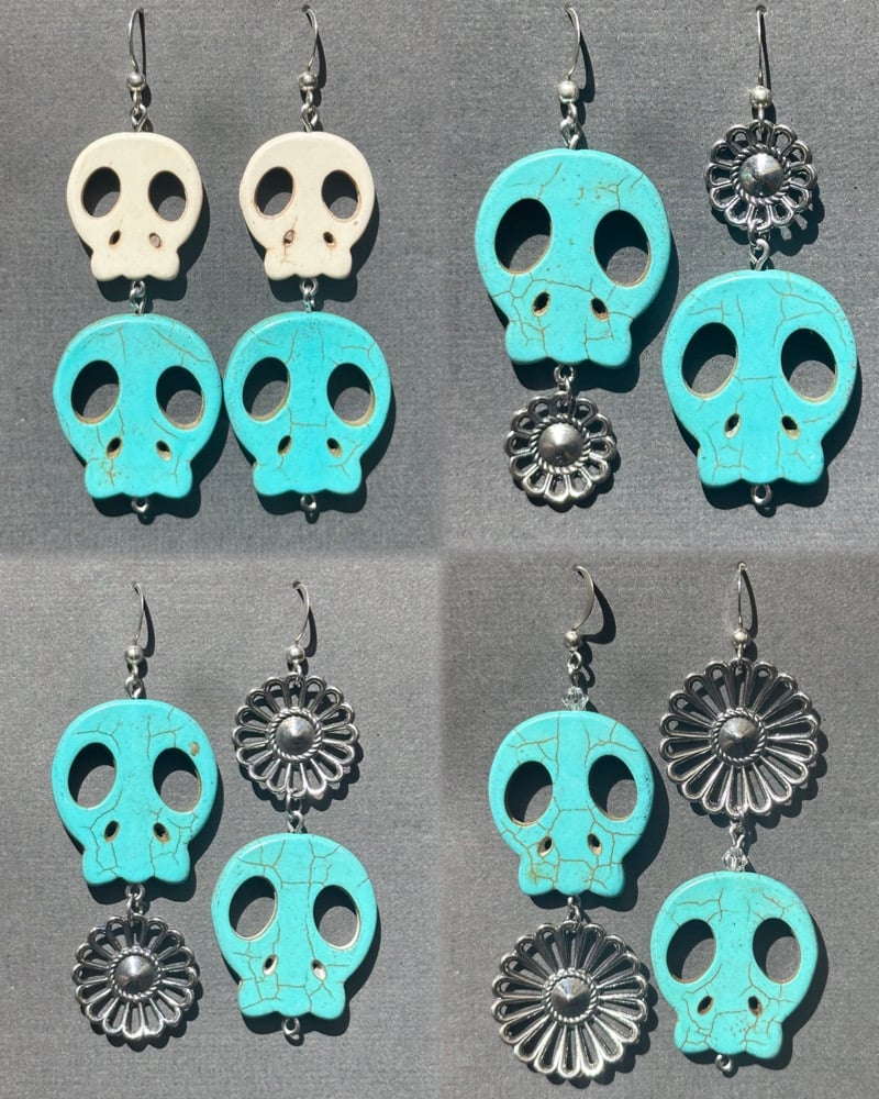 Image of blue skull earrings