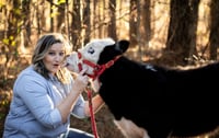 Happy Mooooother’s Day Cow Snuggling Event 