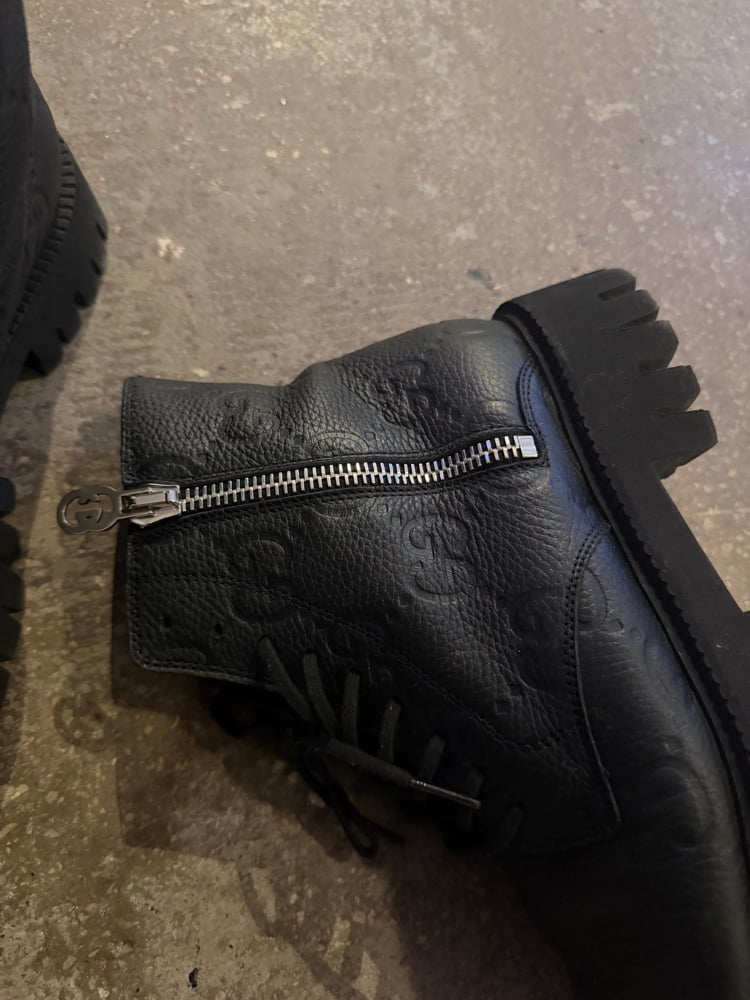Image of Gucci Monogram Debossed Lug Boots