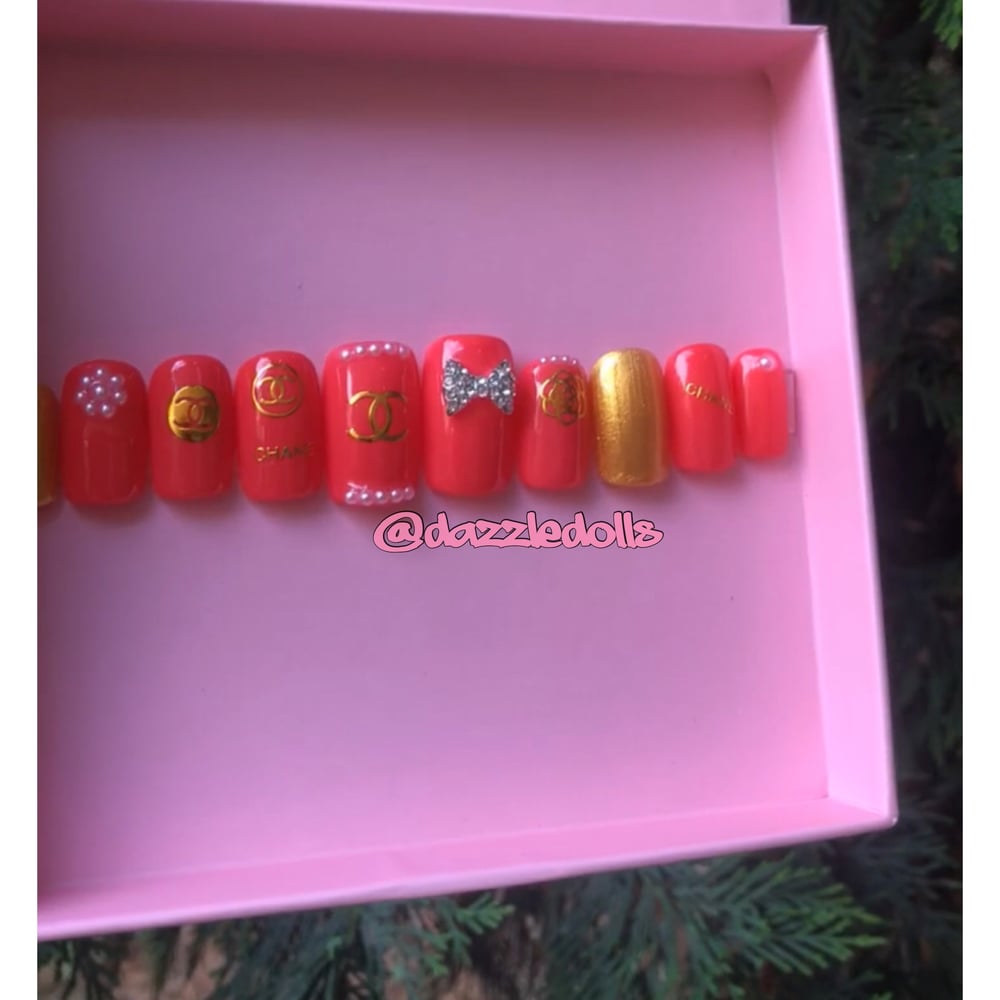 Image of pink chanel inspired short, square shaped set