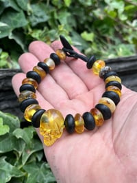 Image 2 of Bog oak and Amber skull bracelet. 