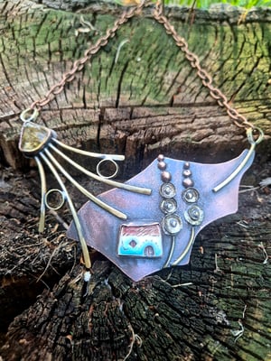 Necklace with a house under a mallow flower