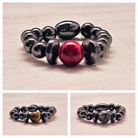 Image 1 of The Red, Black, and Brown Magnetic Ring Collection 