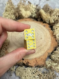 Image 1 of D6 Dice Pair Yellow and Silver Stars