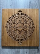 Image of Efe ornament on bambu woodpanel