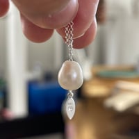 Image 1 of unique pearl charm