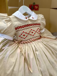Image 1 of Cream and red smocked dress 
