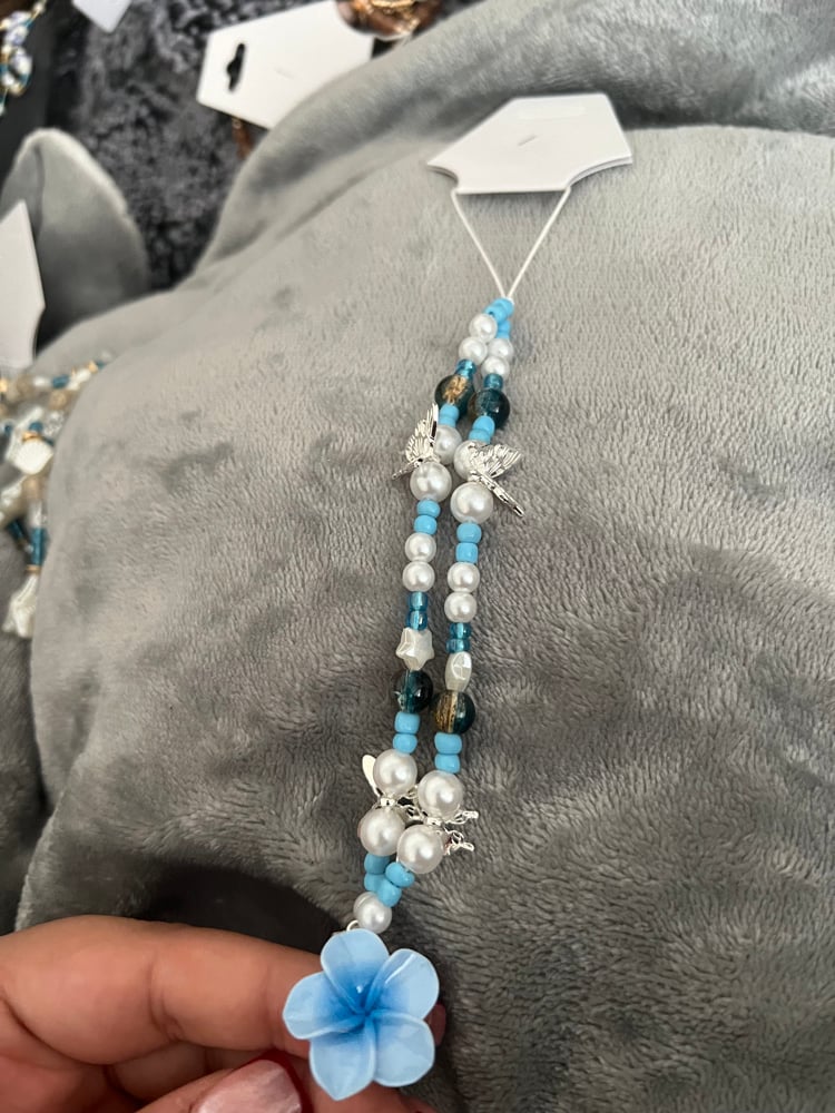 Image of blue flower phone charm