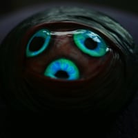 Image 4 of Custom Swappable Phone Grip for smartphones, three iris, reflective pupils, glow in the dark