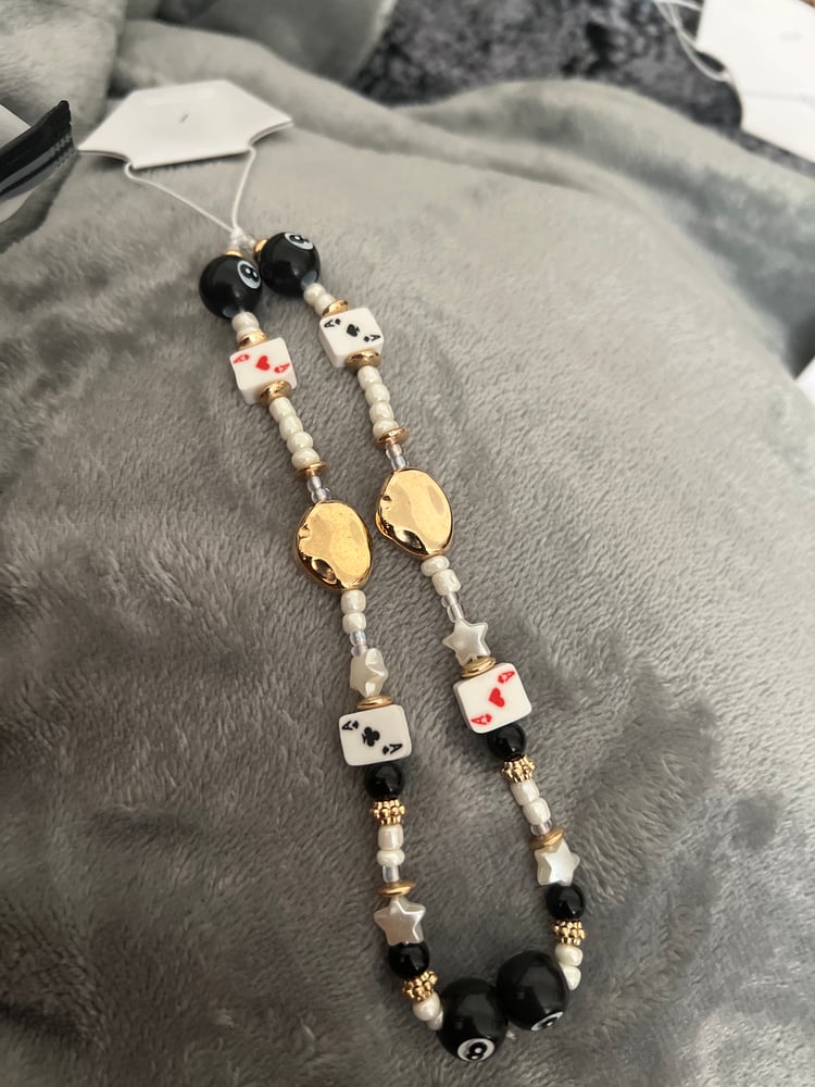 Image of queen of hearts phone charm