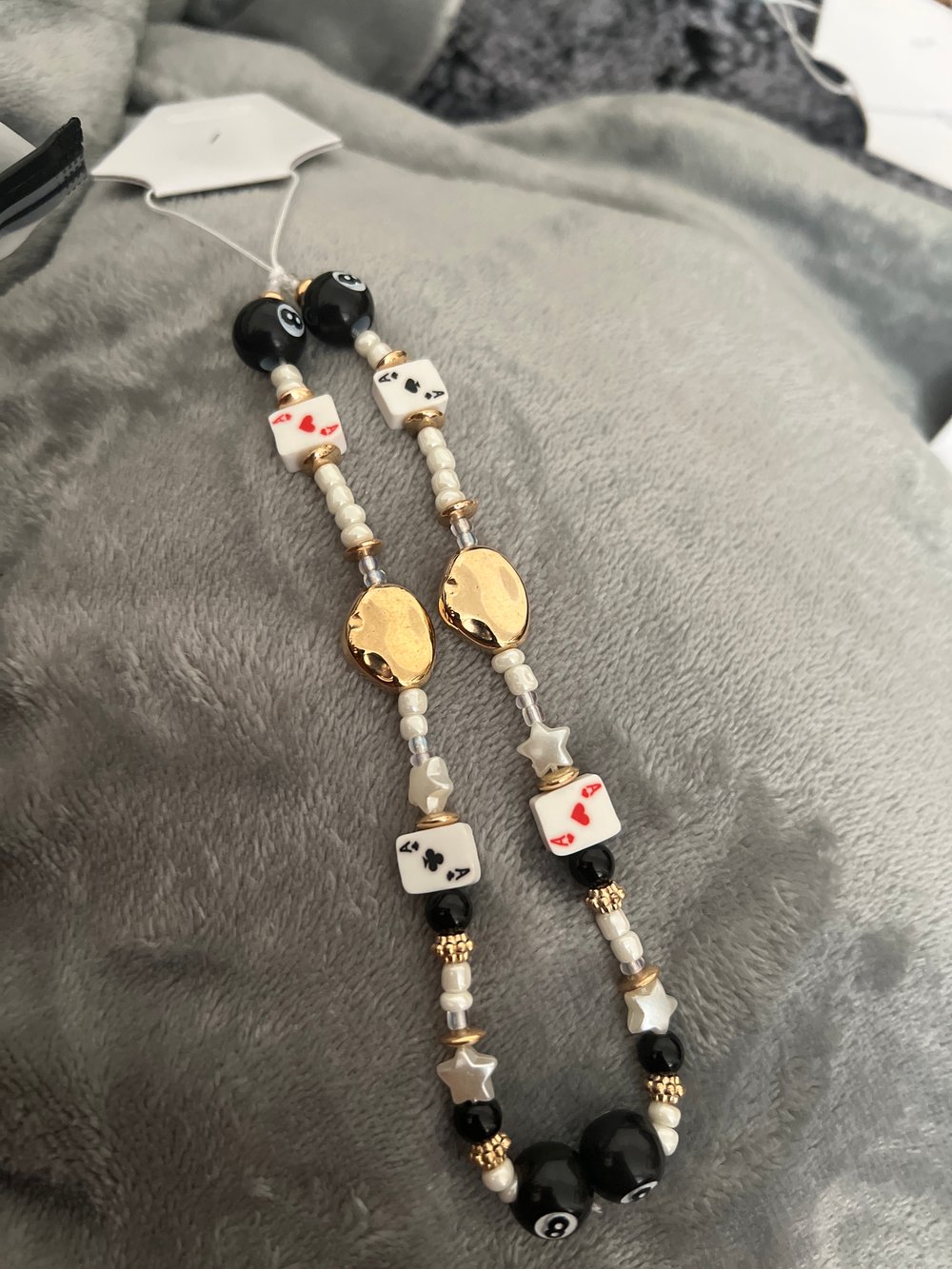 Image of queen of hearts phone charm