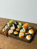 Miniature sushi 1:12 scale on wooden board