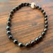 Image of Hand knotted Tahitian pearl necklace with puka shell clasp 18 inch