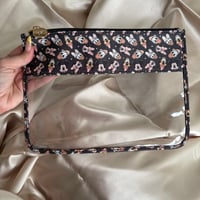 Image 1 of neutral magical friends vinyl pouch