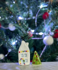 Image 2 of Big House with lights and a Christmas Tree