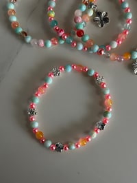 Image 6 of Pastel Beaded Tumbler Bracelet Stack – Pink, Teal & Floral Charm Cup Accessories Set