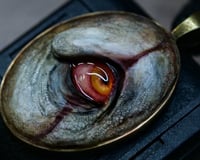 Image 1 of Pennywise Eye glow in the dark pendant OOAK