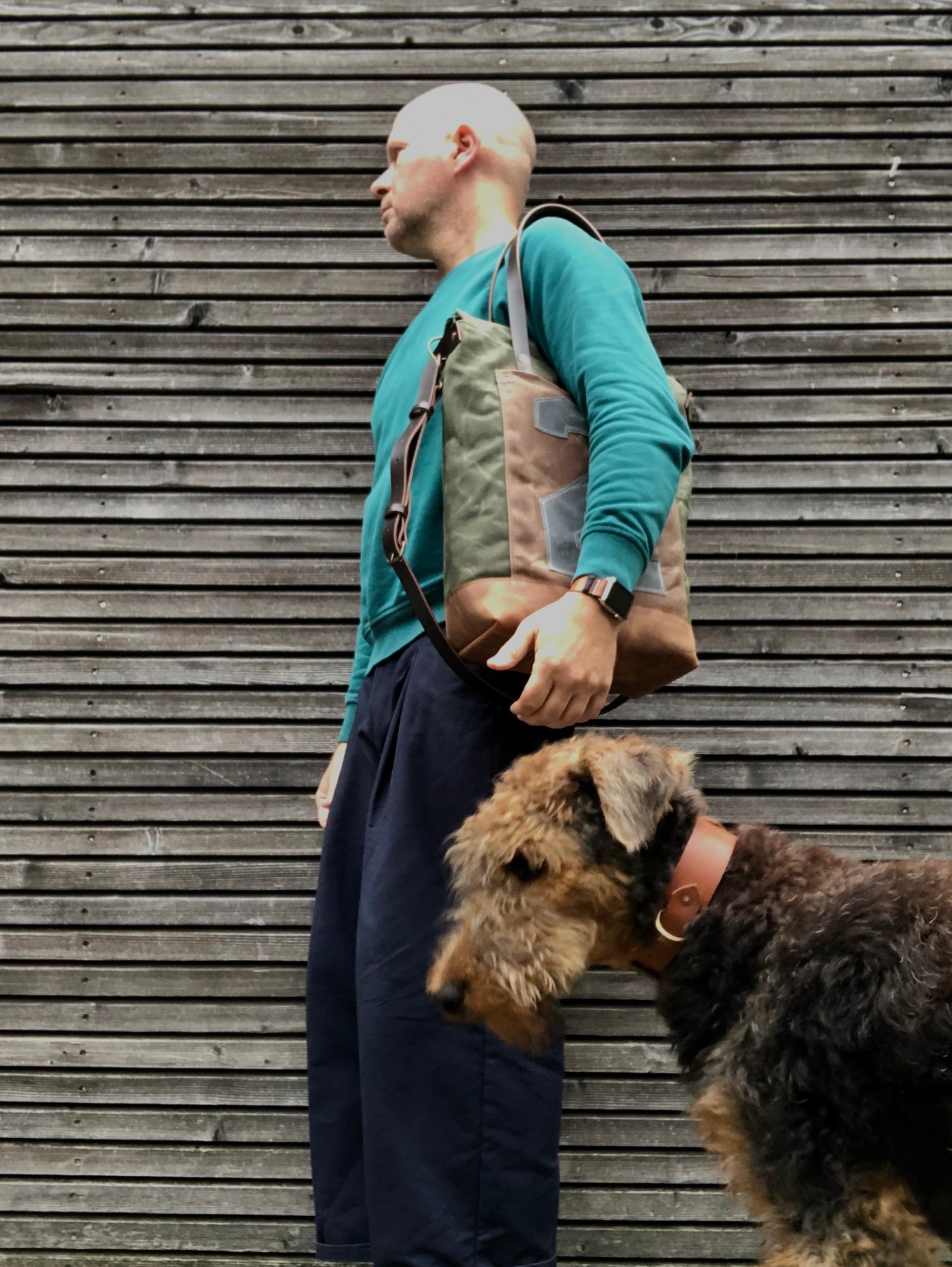 Image of Vertical tote bag made  in waxed canvas with leather straps and cross body strap