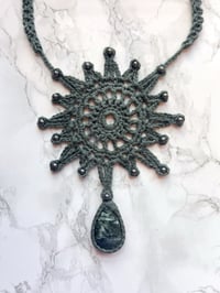 crochet sun necklace with seraphinite and hematite