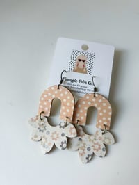 Ditsy floral half bloom arch earrings 