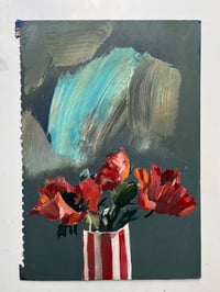 poppies in striped vase