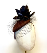 Image 1 of Brown felt button 