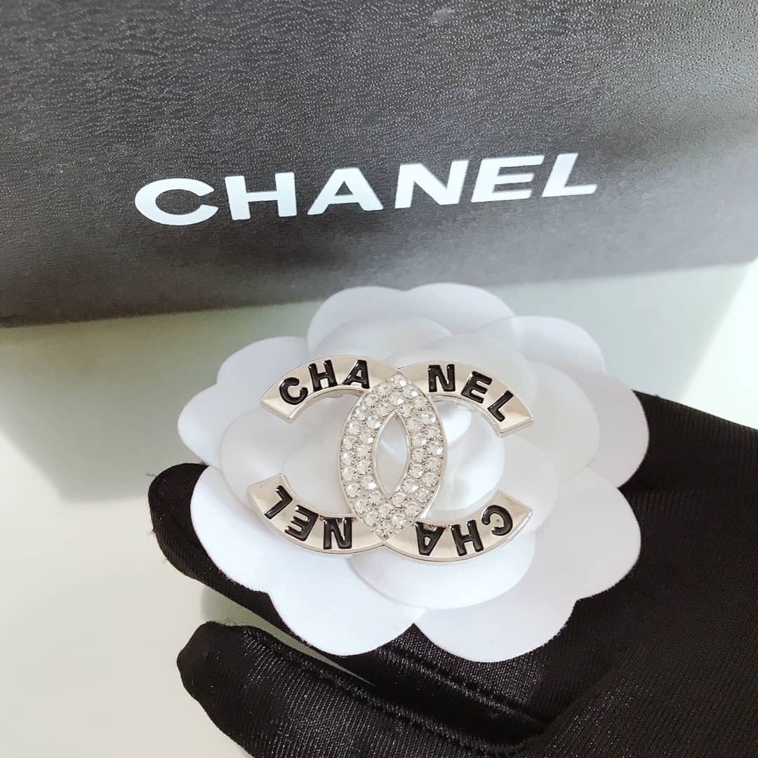 Chanel badge clearance brooch