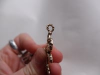 Image 4 of Bird with beak loop in bronze