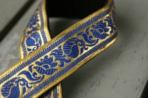 Image of camera strap - peacock on gold