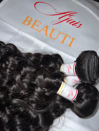Image 1 of Curly